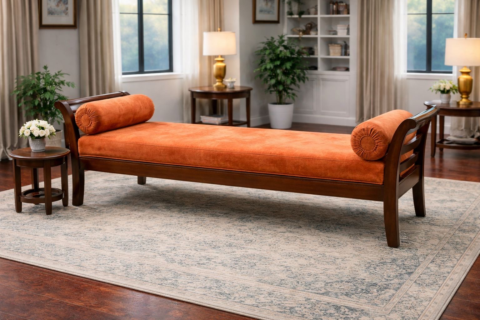 wooden chaise lounge with an orange velvet upholstery.