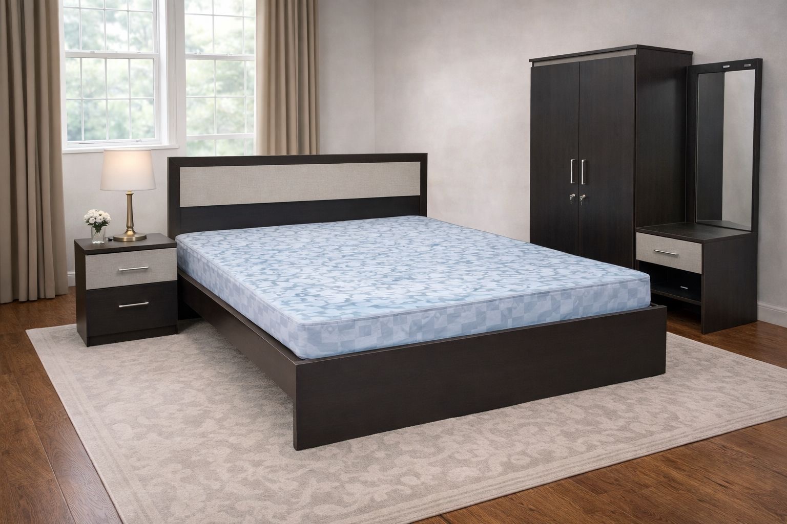 dark‑wood framed bed with an upholstered beige fabric headboard and a blue‑patterned mattress.